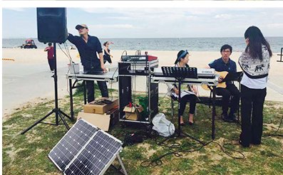 Beach event powered by a portable folding solar panel
